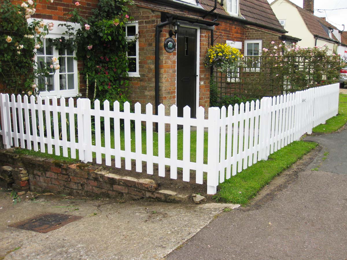 cheap simple front yard landscaping ideas with picket fence 